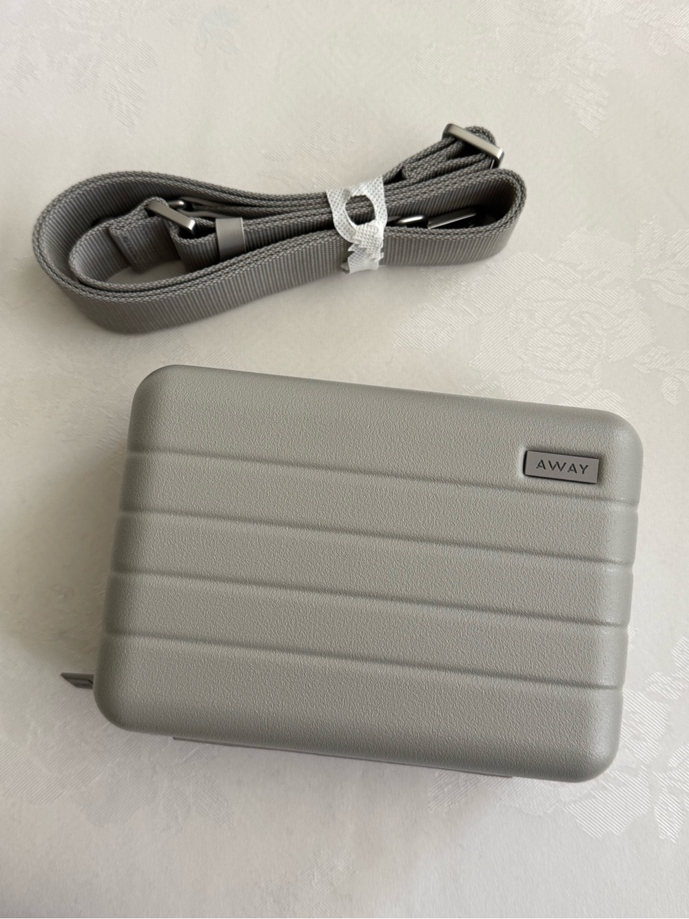 Away Compact Hard-Shell Crossbody Bag in Light Gray